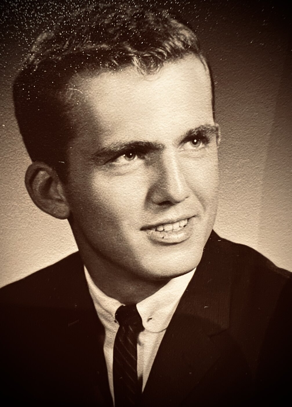 A young man, listening.